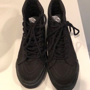 Never worn. All black women’s high top vans